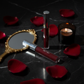 Night Kisses Kiss Me Lip Gloss lifestyle flat lay on black marble